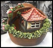 Kleines Haus innerhalb eines Tonkruges.